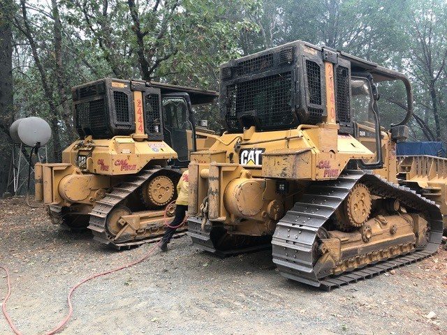 CAT bulldozers parked